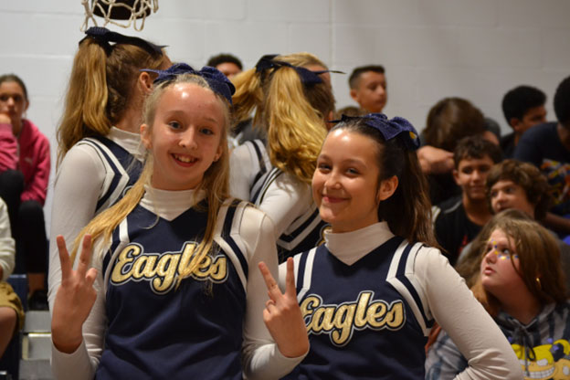 Do cheerleaders receive benefits in addition to their salary